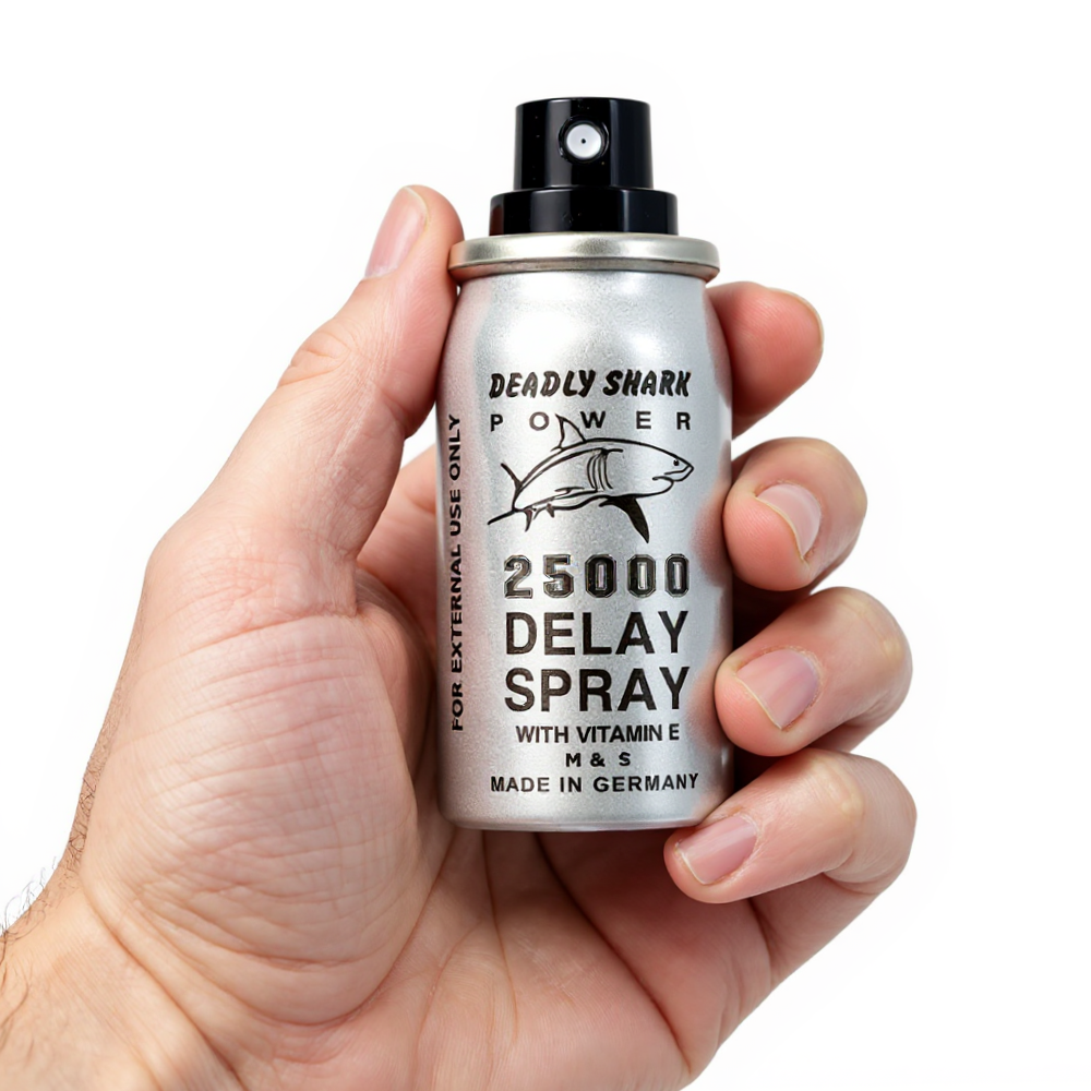 Deadly Shark Power 25000 Delay Spray silver can with shark logo held in hand