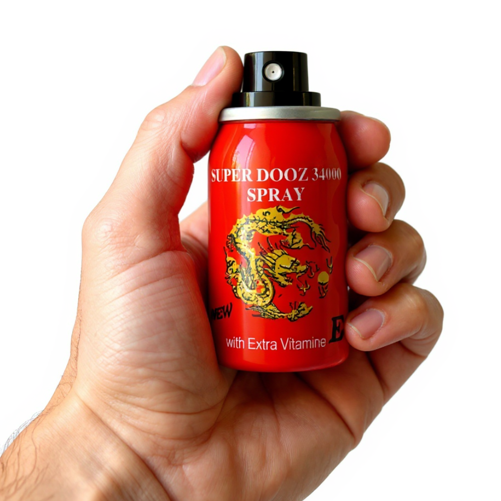 Super Dooz 34000 Delay Spray with Extra Vitamin E, red can held in hand