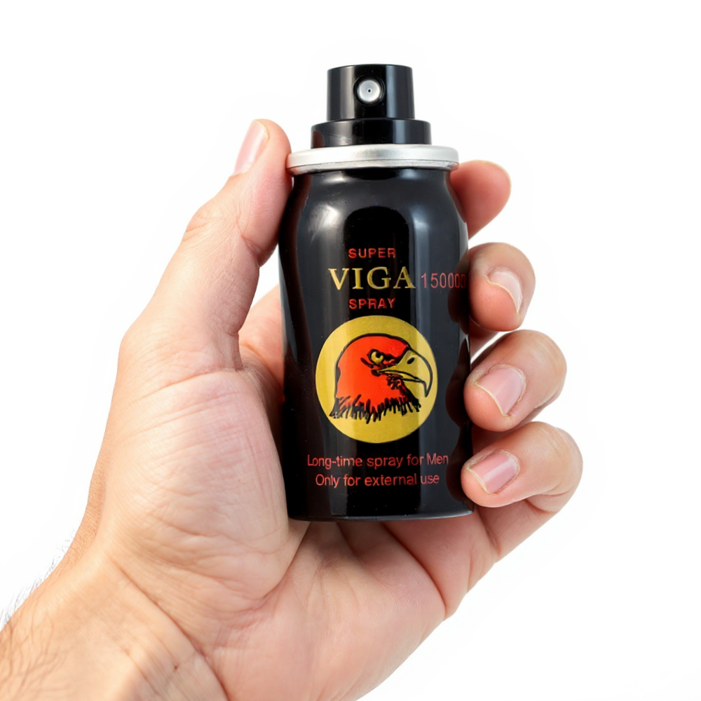 Super Viga 150000 Delay Spray black can with red eagle logo held in hand