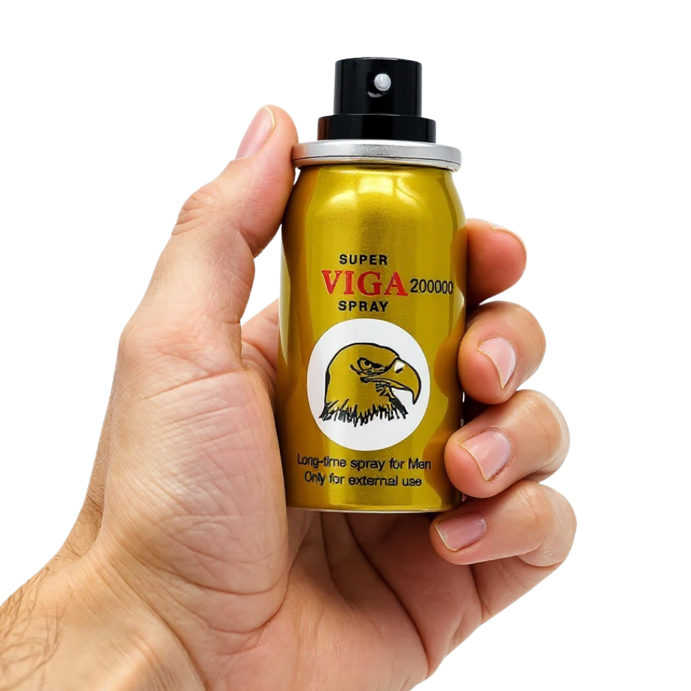 Super Viga 200000 Delay Spray gold can with eagle logo held in hand