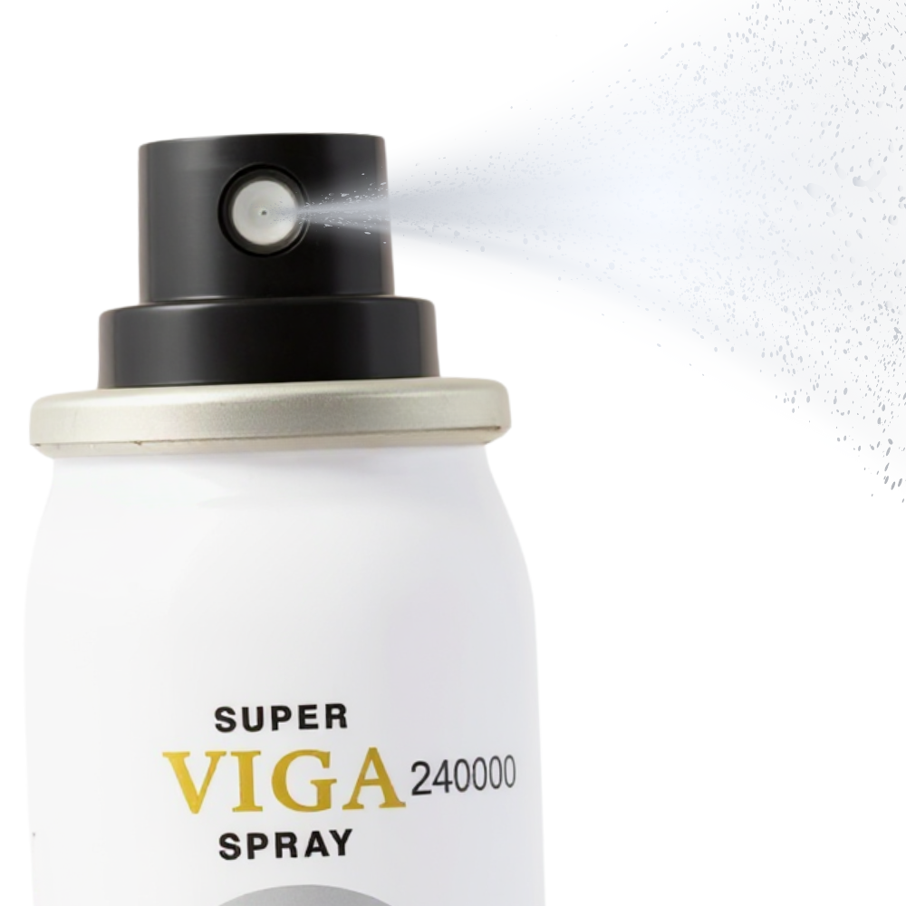 Super Viga 240000 Delay Spray bottle spraying mist, white canister with gold and black text, eagle logo visible on front