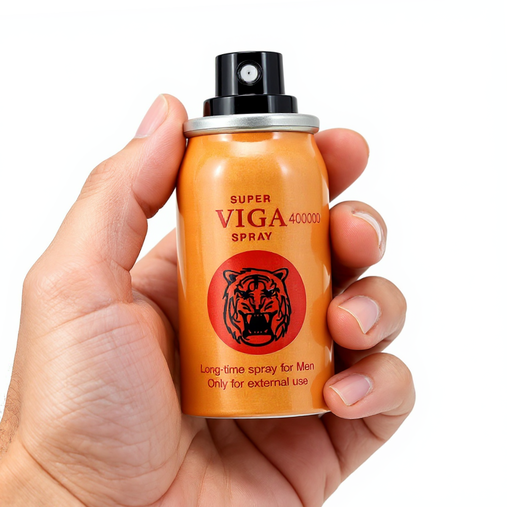 Super Viga 400000 Delay Spray orange can with tiger logo held in hand