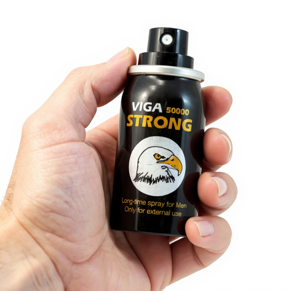 Viga 50000 Strong Delay Spray black can with eagle logo held in hand